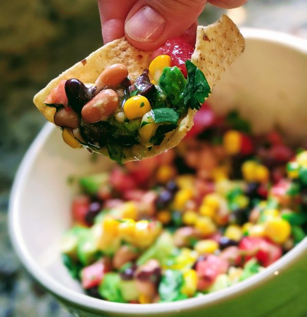 black bean and avocado salad on a chip