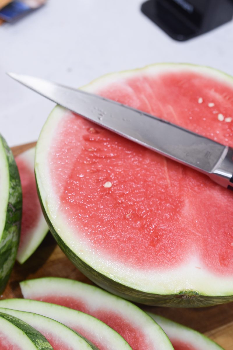 knife on top of watermelon