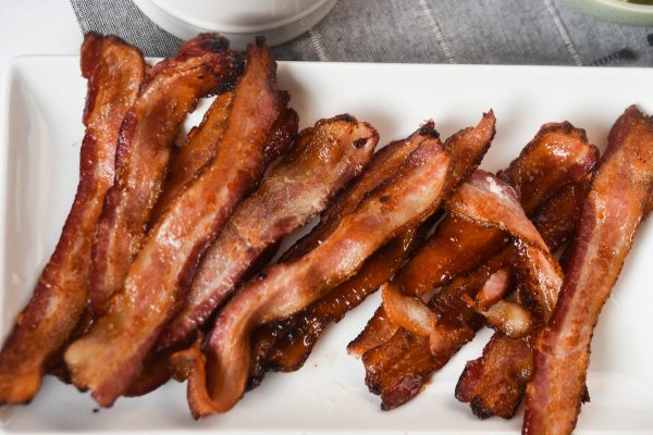air fryer bacon on white dish