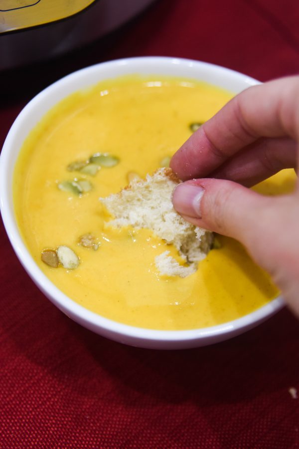 dipping bread into soup