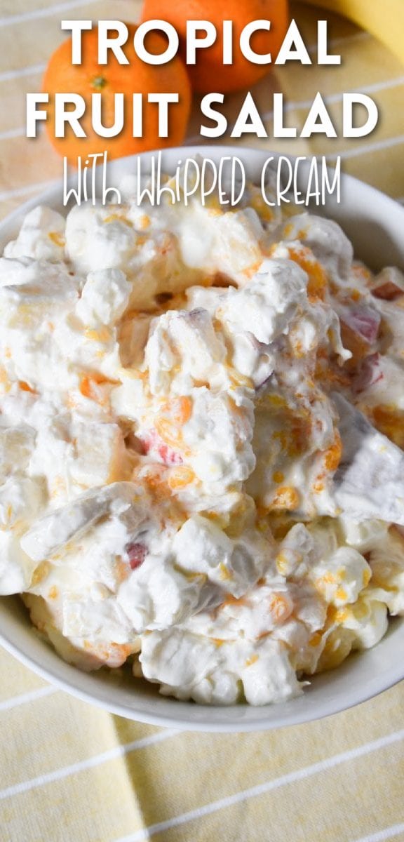 This tropical fruit salad is the refreshing and creamy salad you've been dreaming of! It's filled with delicious fruit, coconut, pudding mix, and whipped cream- this delicious fruit salad sure to be a crowd-pleaser! via @simplysidedishes89