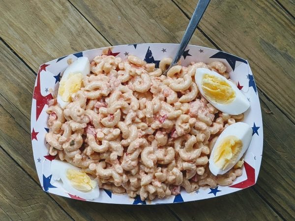 amish macaronia salad in bowl with eggs