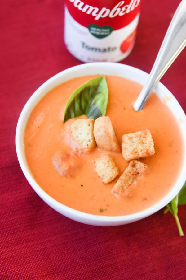 bowl of tomato soup with toppings