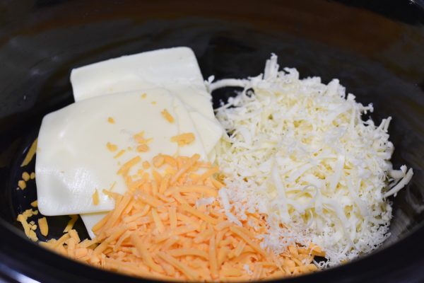 slow cooker full of cheese