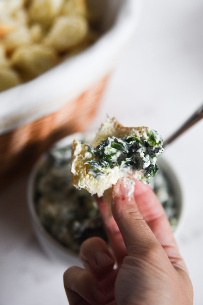 bread with spinach dip on it