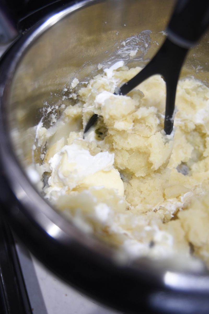 mashing potatoes with sour cream