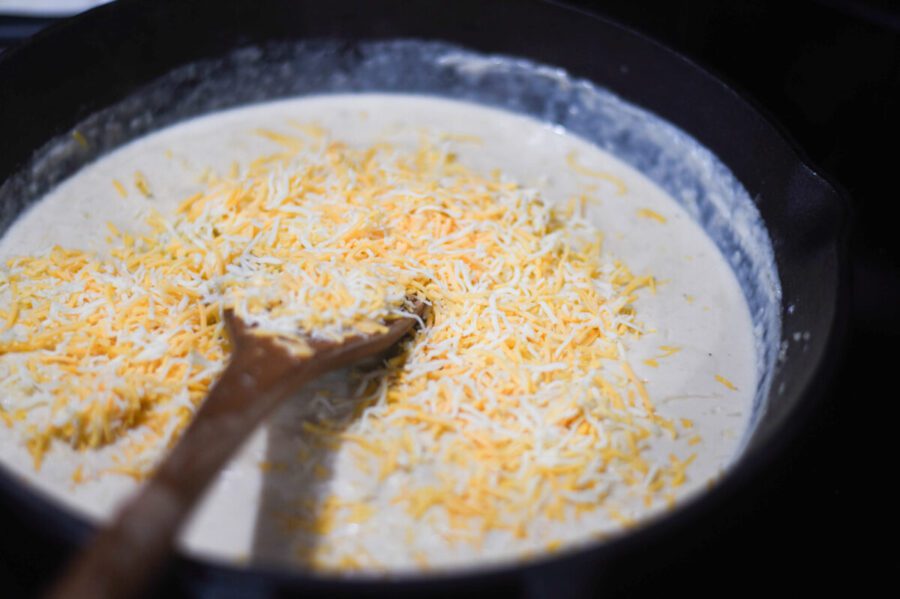 mixing cheese in with sauce